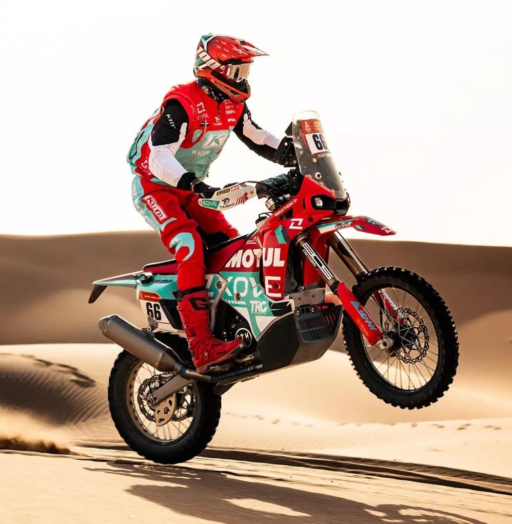 Close up of KOVE rally bike in sand